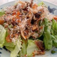 Salmon Skin Salad · Cooked salmon skin salad with mixed vegetables.