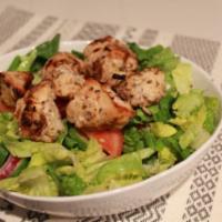 Grilled Chicken Salad · Lettuce, tomatoes, cucumber topped with grilled chicken breast and mixed with balsamic vinai...