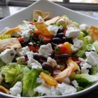 Greek Salad · Feta cheese mixed with romaine lettuce, tomatoes, olives, cucumbers, bell peppers and mixed ...