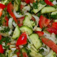 Armenian Salad · Finely chopped romaine lettuce, tomatoes, cucumbers, bell peppers and radishes dressed with ...