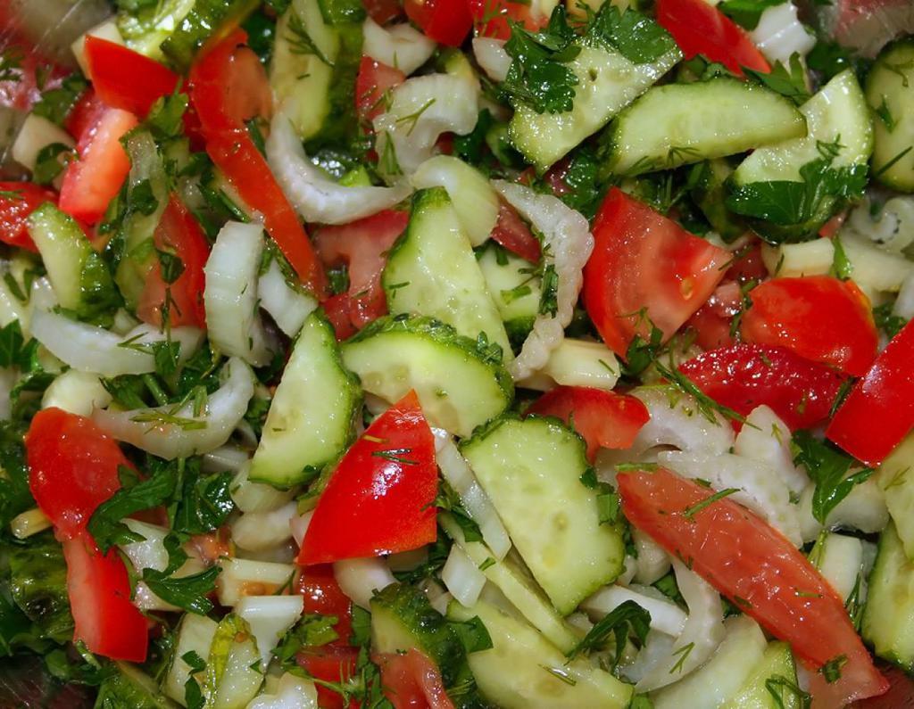 Armenian Salad · Finely chopped romaine lettuce, tomatoes, cucumbers, bell peppers and radishes dressed with lemon juice and olive oil.