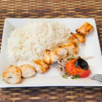 Shish Tawook Chicken Kabab · Chunks of marinated succulent chicken breast cooked in a special pan. Served with our house ...