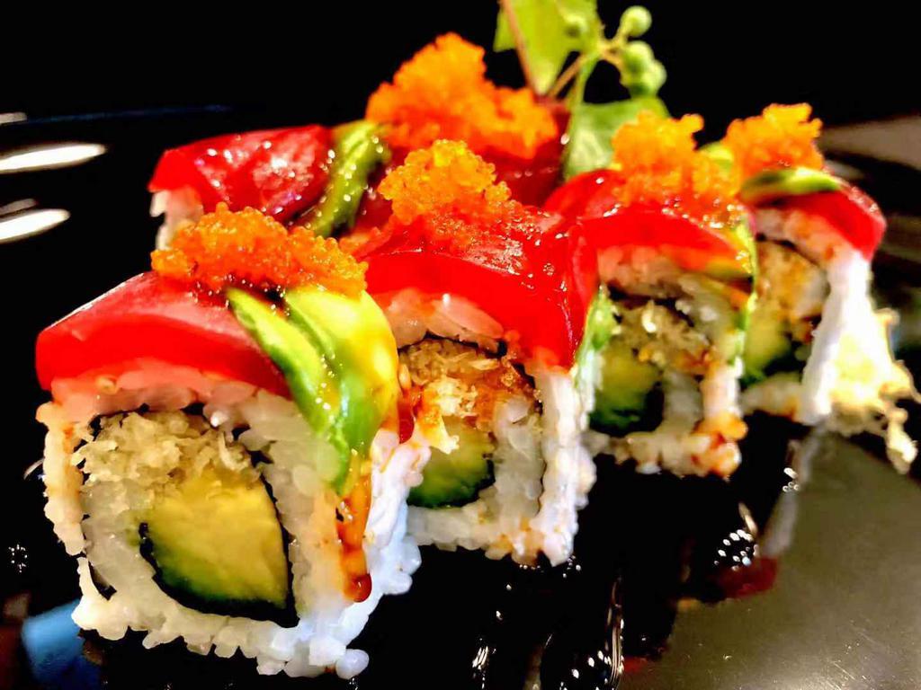Ahi Crunch Roll · Royal Stix recommends. Avocado and tempura crunch roll topped with fresh tuna, avocado, masago, eel sauce, and chili sauce. Spicy.