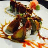 Dragon Roll · Shrimp tempura, cucumber, topped with fresh water eel, avocado, and teriyaki sauce.
