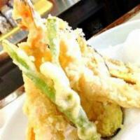 Shrimp Tempura Sampler · Japanese. Tempura fried shrimp, sweet potato, zucchini, and broccoli. Served with a traditio...