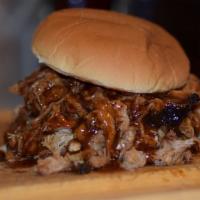 Mr. Pig Pulled Pork Sandwich · Award-winning slow-smoked pulled pork on a fresh bun with DR Famous BBQ sauce.