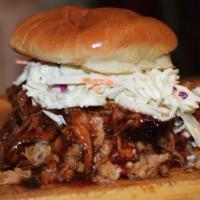 Miss Piggy Pulled Pork Sandwich · Pulled pork on a fresh bun topped with DR coleslaw and Famous DR BBQ sauce. This is a classic.