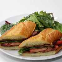 BLT Sandwich · Thick cut bacon, lettuce, tomato, basil mayo, toasted challah baguette, served with mixed gr...