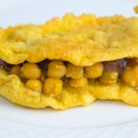 Doubles · A traditional staple, doubles are 2 fried barra dough stuffed with curried chickpeas, tamari...
