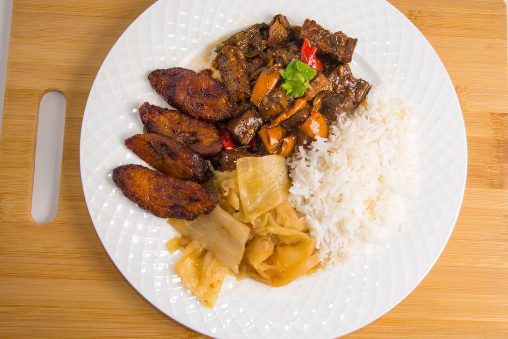 Jerk Tofu Platter (Vegan) · Tofu in a jerk sauce of baby bell peppers and snow peas with your choice of rice and veggies.  Platter comes with plantains (5). 

Your choice: 
Basmati (white) rice or peas and rice
Stewed Spinach or stewed cabbage