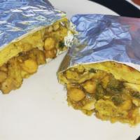 Chicken Roti · Curry chicken with chickpeas and potatoes wrapped in dhalpuri roti.