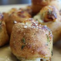Bacon Cheddar Vocelli Rolls · Our signature dough wrapped around bacon and cheddar, stuffed with mozzarella cheese, brushe...