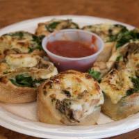 Spinach and Mushroom Vocelli Rolls · Our signature dough wrapped around spinach and mushrooms, stuffed with mozzarella cheese, br...
