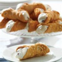 Cannoli · An Italian pastry classic! Two flaky shells filled with a sweet, creamy filling and chocolat...