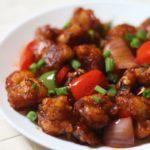 87. Gobi Manchurian · Deep-fried cauliflower sauteed with onions, bell peppers and Manchurian sauce.