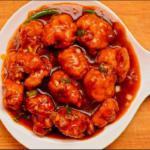 88. Chicken Manchurian · Battered chicken sauteed with onions, bell peppers and Manchurian sauce