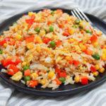 91. Egg Fried Rice · Basmati rice stir-fried with eggs, green peas, cabbage, carrots and bell peppers.