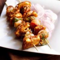 100. Paneer Tikka · Cubes of cottage cheese marinated in fresh spices, and roasted in a clay oven.serve with nan