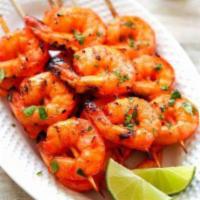 103. Tandoori Shrimp · Jumbo shrimp marinated in a special sauce and roasted in a clay oven. come with nann bread