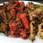 104. Mixed Grill · Assortment of chicken tikka. tandoor chicken, seekh kabab, tandoori shrimp, and malai kabab....