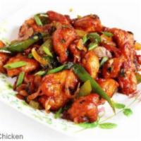11. Chilli Chicken+Naan · Deep-fried chicken sauteed with onions, bell peppers & green chilies.