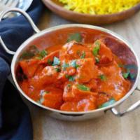 23. Chicken Tikka Masala · Marinated boneless chicken cooked in the tandoori oven & finished in a rich tomato-based gra...