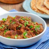 34. Lamb Curry · Tender cubes of boneless lamb cooked in a mildly spiced curry sauce.come with rice