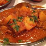 39. Lamb Vindaloo · Tender cubes of boneless lamb cooked with potatoes in a spiced curry sauce.
