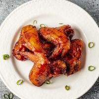 Southern Style Grilled Chicken wings · 4 Jumbo wings of my old faithful southern recipe glazed with a mild house made sauce.