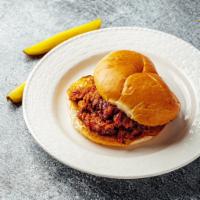 Pulled Pork Sandwich  · Pulled Pork Sandwich slow cooked served on a brioche bun with pickles on the side.