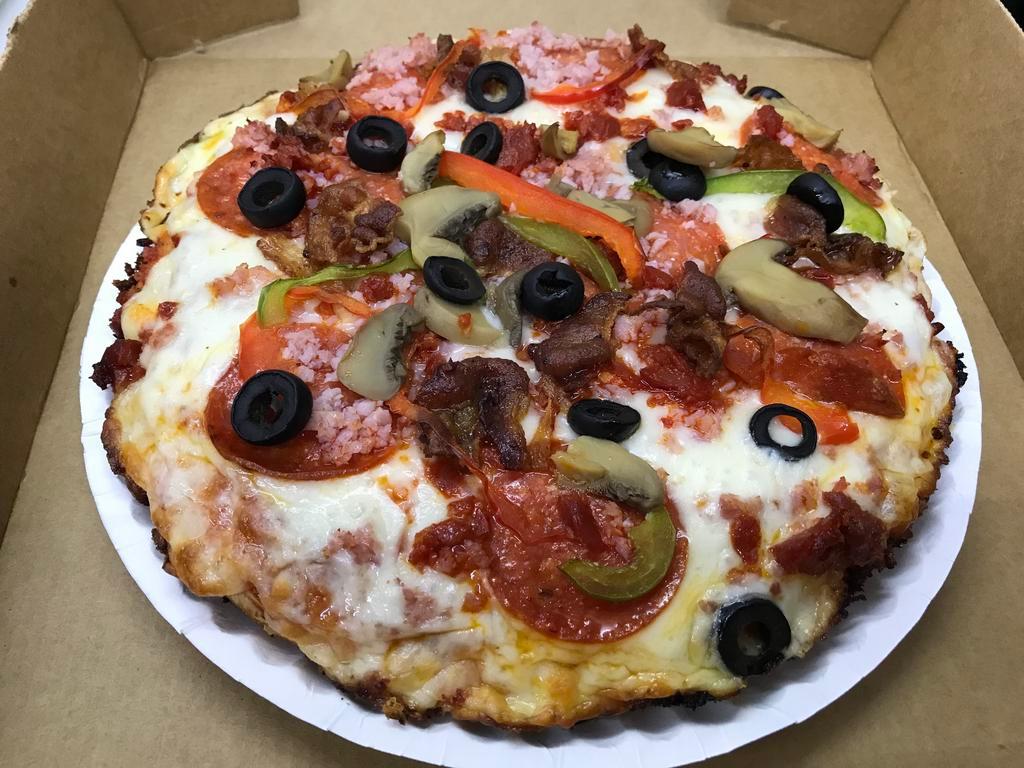 DP Suprema Pizza · Ham, pepperoni, chorizo, cebolla, bacon, black olives, peppers and mushrooms.