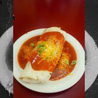 Smothered breakfast burrito · Bacon,ham or sausage scrambled with eggs and potatoes topped with cheese rolled in a tortilla and Smothered in red or green Chile sauce and topped with more cheese.