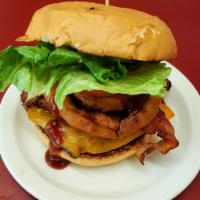 Double Western bacon cheese burger · 2 Angus burgers topped with onion rings crisp bacon on Sweet Baby Ray's BBQ sauce on a toast...