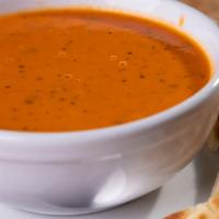 Soup of the Moment · Served with pita bread selections may vary.
