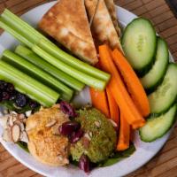 Hummus Plate · Traditional homemade hummus drizzled with olive oil and sprinkled with paprika. Served with ...