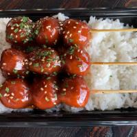 Meatball Skewer Bowl · Beef and Chicken Meatballs on skewers with savory sauce over the rice.
3skewers.