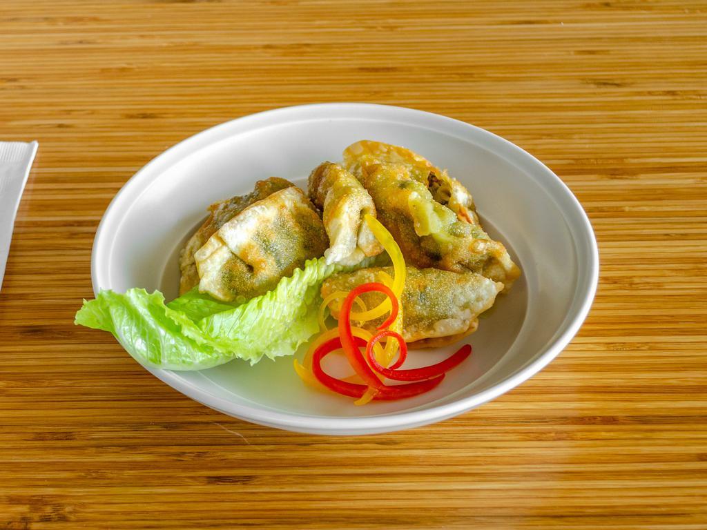 Gyozas · Choose pork or Vegetable
-filled dumpling served with a savory dipping sauce.