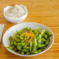 Zesty Edamame · Steamed soybean seasoned with zesty homemade roasted chili sauce and topped with crispy frie...