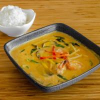 Red Curry · Thai red curry paste with bamboo shoots, green bell pepper, basil, eggplant, and coconut milk.