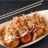 Takoyaki · Ball-shaped Japanese snack. Made of a wheat flour-based batter and filled with minced octopu...