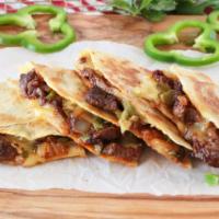 Quesadilla Ribeye Steak · Served with tomatoes, onions, bell peppers with salad an sour cream.