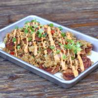 Arroz Cervezero · Chorizo Argentino, fried rice, spicy beer eel, soy, red bell pepper, pickled onions, smoky r...