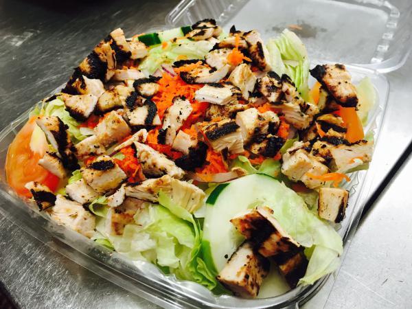 Chicken Breast Salad · Grilled chicken breast, iceberg lettuce, red onion, cucumber, tomato, carrot and choice of dressing.