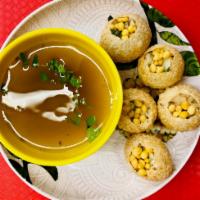 Pani Puri · Round, hollow puri, fried crisp and filled with a mixture of flavored water (pani), tamarind...