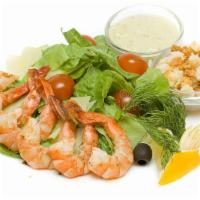 Shrimp Caesar Salad · The original Caesar topped with shrimp marinated in dill and perfectly grilled.