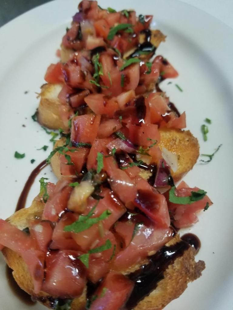 Bruschetta · Lightly toasted Italian bread topped with diced tomatoes, garlic and basil, tossed in olive oil.