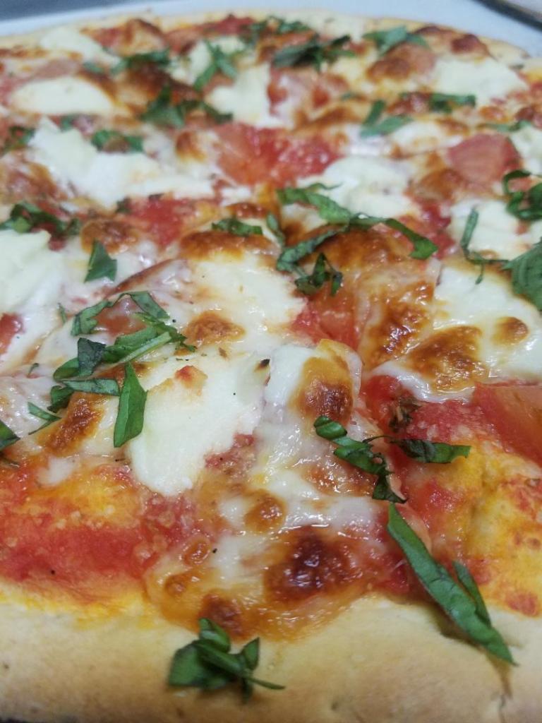 Sicilian Thin Crust Pizza · Fresh tomato, basil and ricotta. No substitutions.