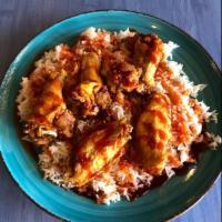 Mambo Wings on Rice · Naked or breaded. A mixture of flats and drums served on white rice covered in our homemade ...