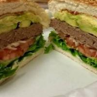 6. Beef Burger  · Grilled patty on a bun.  Topped w/ mayo lettuce tomatoes onions ketchup.