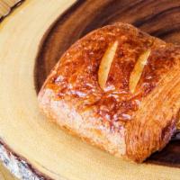Pain Au Chocolat · Flaky pastry with chocolate inside. Contains: wheat, milk, egg, and soy. May contains: trace...